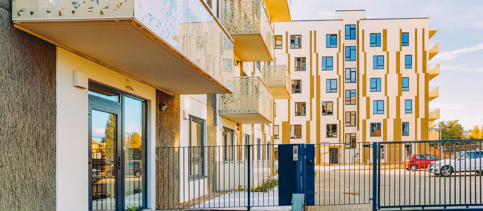 Modern apartment building with an entrance gate