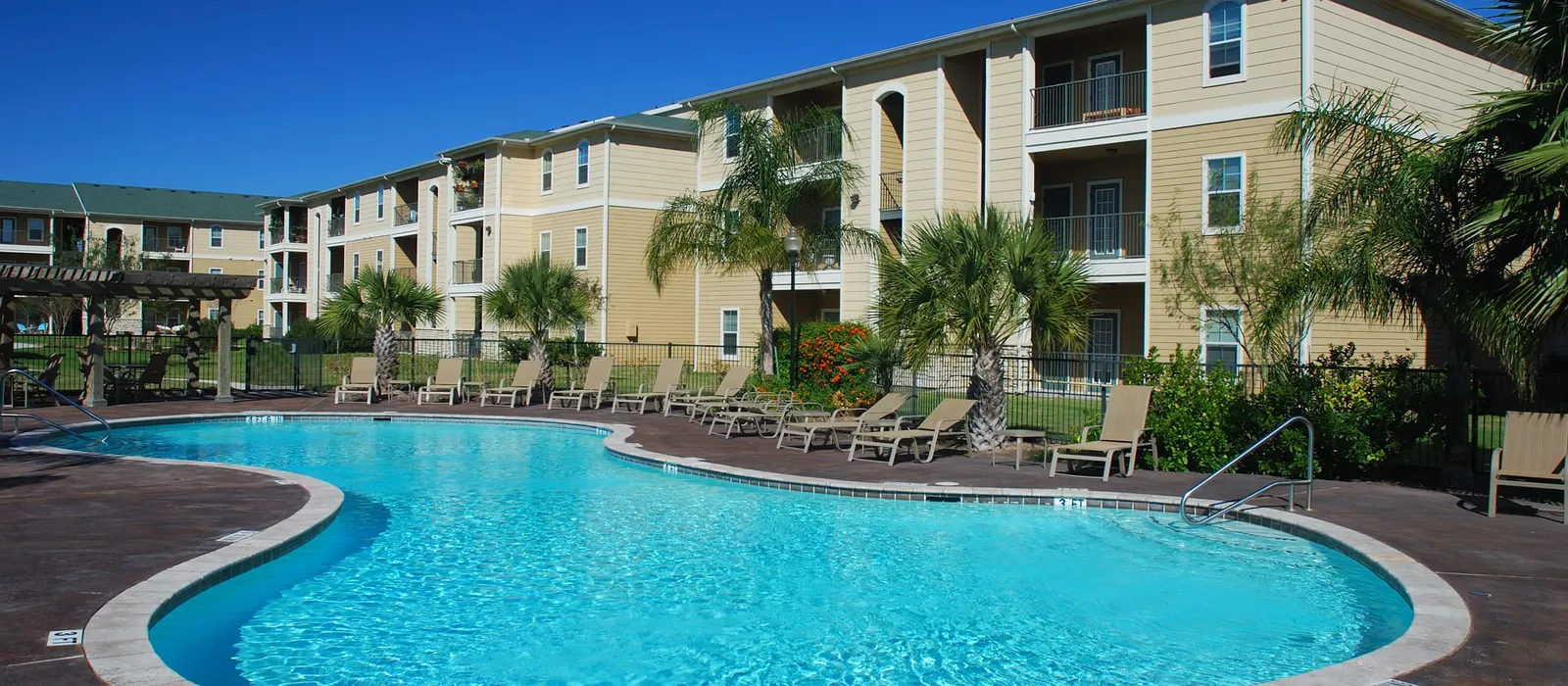 Apartment building with a large round pool