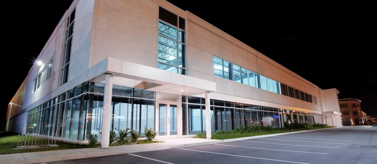 Modern commercial building lit at night