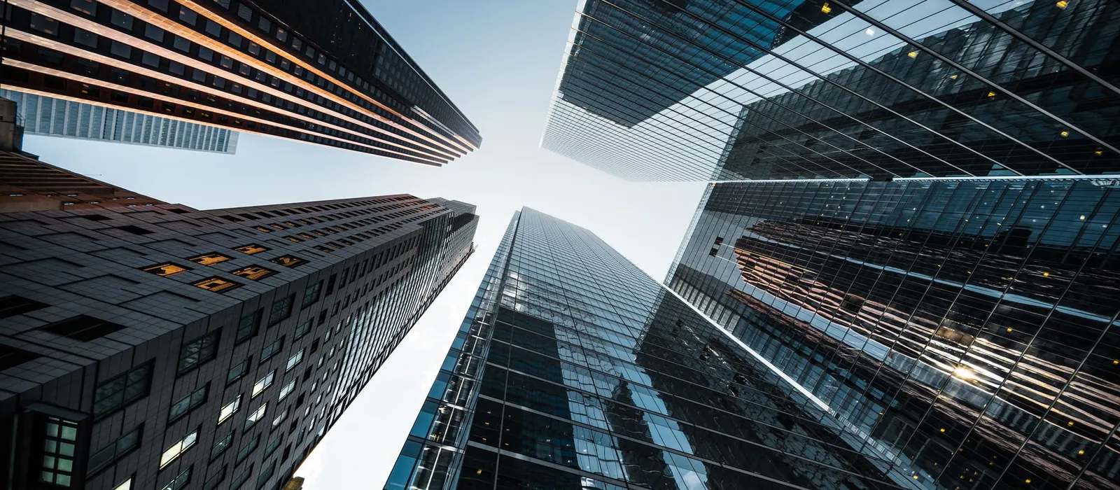 High-rise office towers in a financial district, seen from below