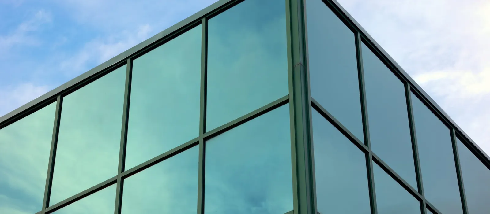 Modern glass corner office building