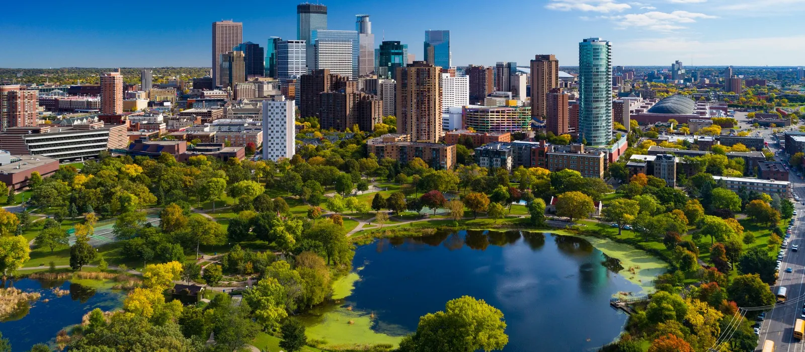 Aerial view of the Minneapolis skyline with a park and lake
