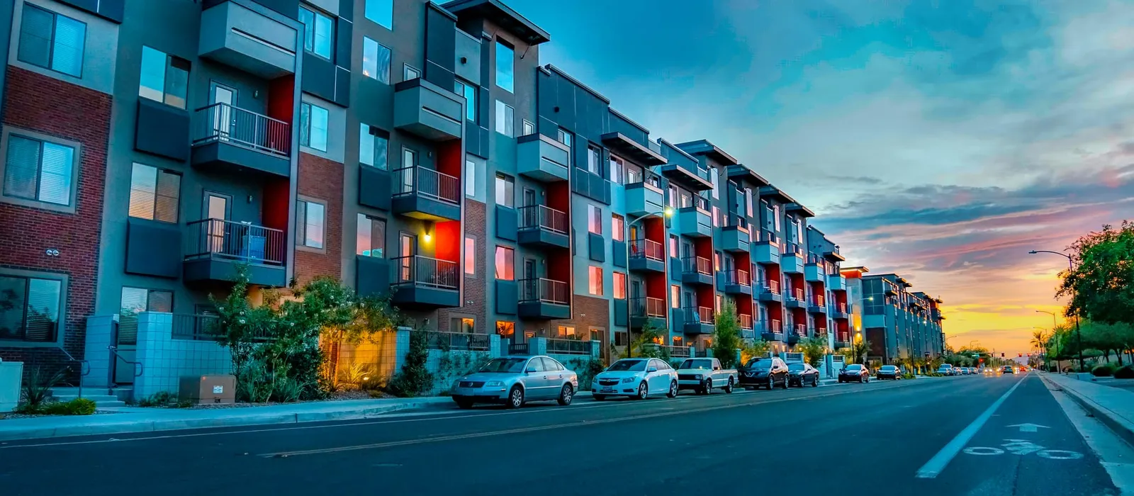 Modern mid-rise apartment buildings along a street