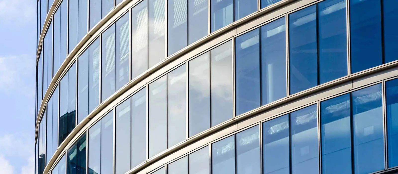 Curved glass facade of a city office building