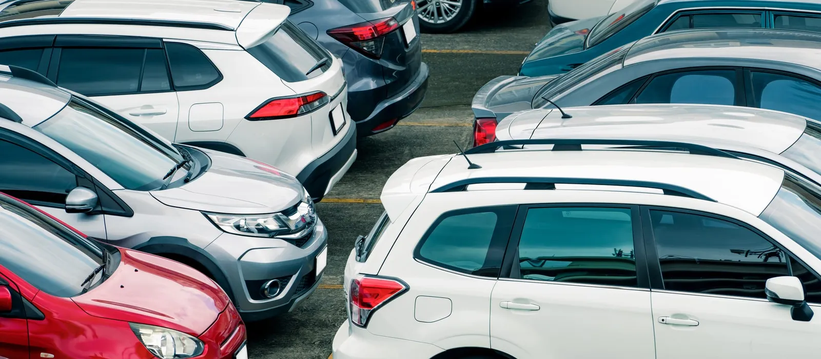 Rows of cars in a surface parking lot