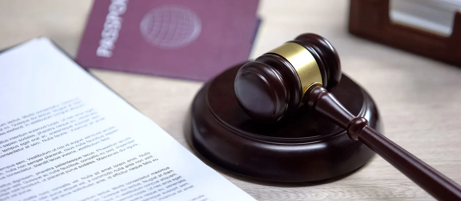 Passport and gavel on a table