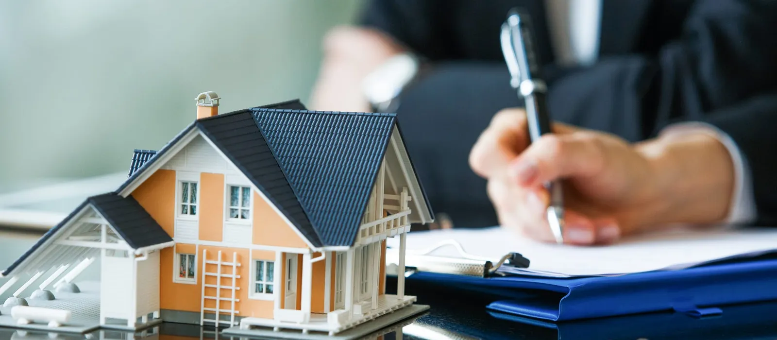 Purchase agreement for a new house being signed