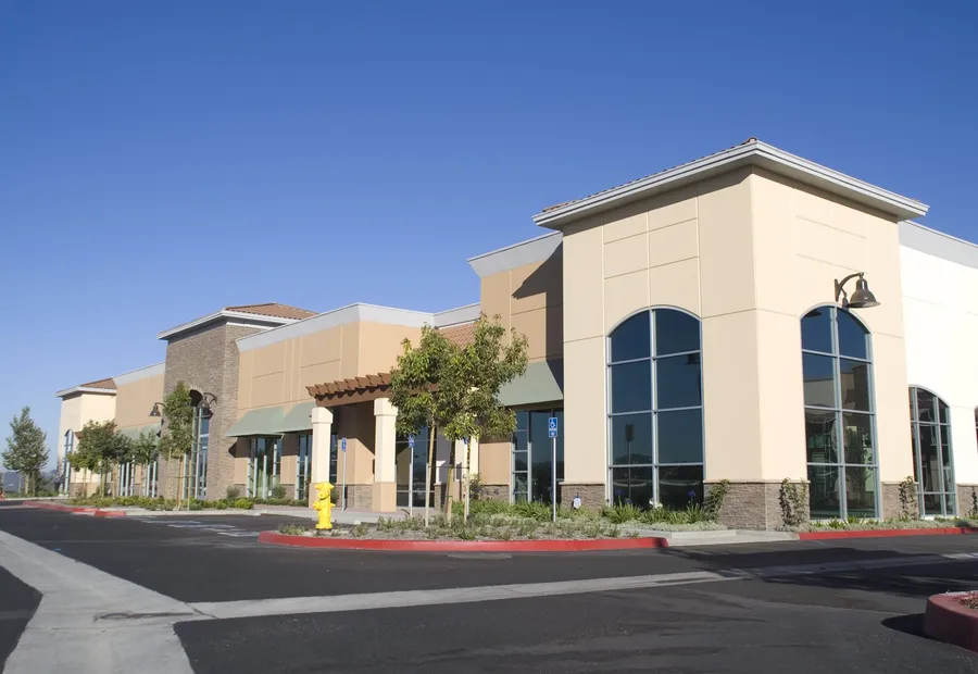 Single-storey retail center with tenant storefronts
