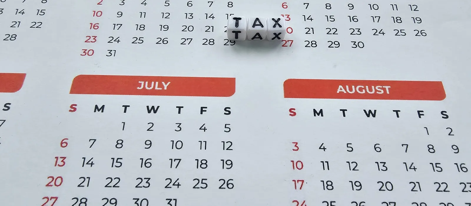 Monthly calendar with a tax reminder highlighted