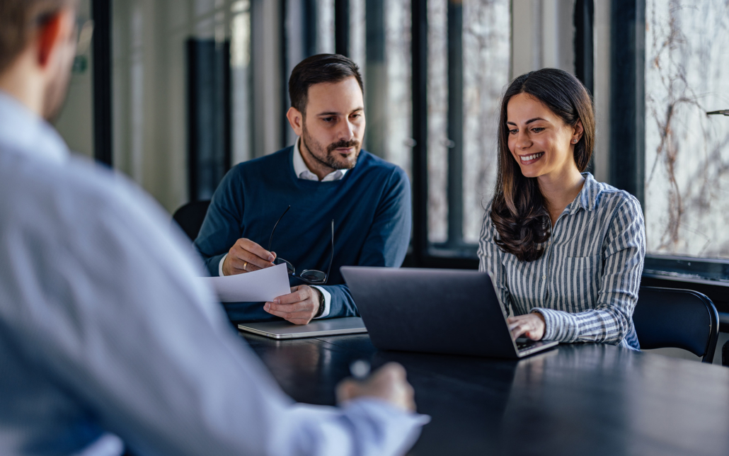 Concentrated Caucasian Man, Looking At His Female's Partner Laptop