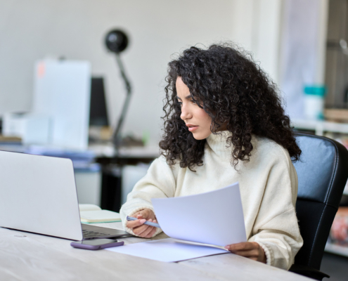 Person Doing Taxes At Table